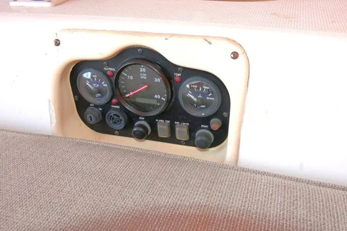 Slide: The Image of Instrument panel of a 2001 Hunter 420 sailboat with gauges and controls. - 43