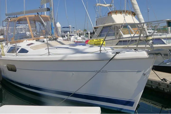 The Image of Sailboat docked at marina, Hunter 420 model, 2001, with clear skies. - 1