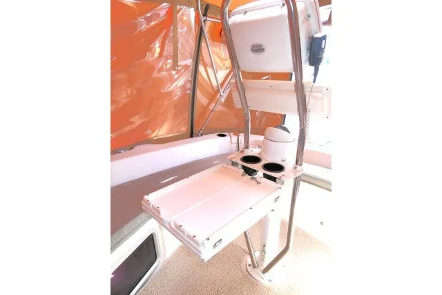 Slide: The Image of Cockpit area of a 2001 Hunter 420 sailboat with orange canopy and foldable table. - 50