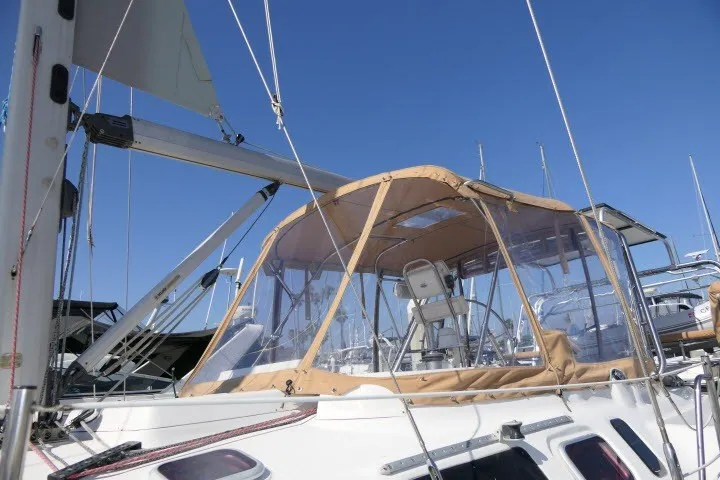 Slide: The Image of Sailboat Hunter 420, 2001 model, with tan canopy under clear blue sky. - 65