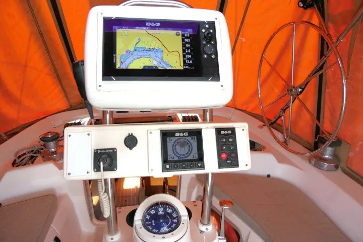 Slide: The Image of Navigation equipment on a 2001 Hunter 420 sailboat with orange canopy background. - 41
