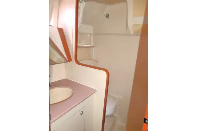 Slide: The Image of Compact bathroom in 2001 Hunter 420 sailboat with sink and toilet. - 32