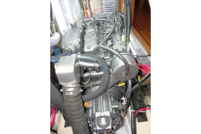 Slide: The Image of Engine of a 2001 Hunter 420 sailboat, showcasing intricate mechanical components. - 91