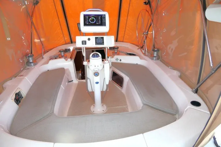 Slide: The Image of Cockpit of 2001 Hunter 420 sailboat with navigation equipment and seating. - 36