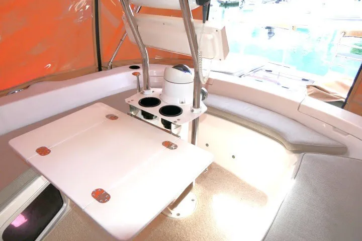Slide: The Image of Interior of 2001 Hunter 420 sailboat with table and seating area. - 51