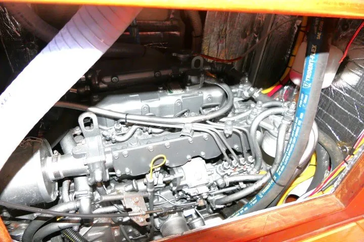 Slide: The Image of Engine compartment of a 2001 Hunter 420 sailboat, showcasing intricate mechanical components. - 94