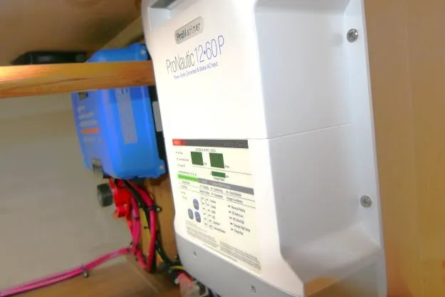 Slide: The Image of ProNautic 12-60P marine battery charger installed on a Hunter 420, 2001 model. - 82