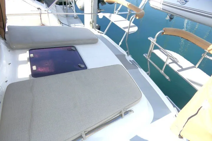 Slide: The Image of Hunter 420 sailboat deck with cushioned seating, 2001 model, docked at marina. - 55