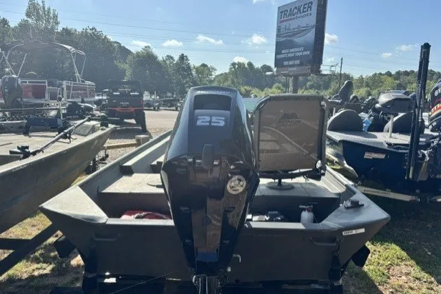 The Image of 2022 WeldBilt 1648V boat with 25 HP motor in outdoor dealership setting. - 1