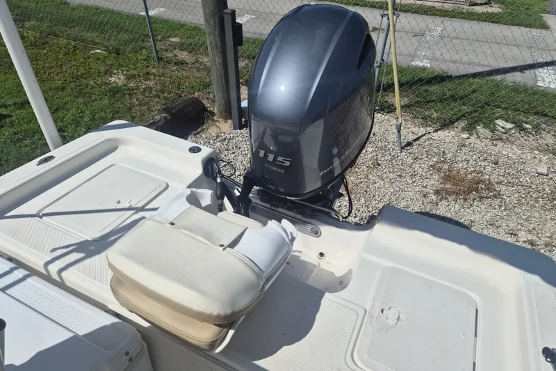 Slide: The Image of 2017 Key West 176 Bay Reef boat with Yamaha 115 engine, parked on gravel. - 7