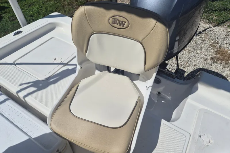 Slide: The Image of 2017 Key West 176 Bay Reef boat seat with beige and white upholstery. - 9