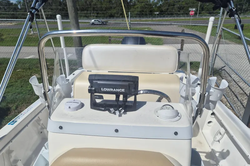Slide: The Image of 2017 Key West 176 Bay Reef boat dashboard with Lowrance device and steering wheel. - 19