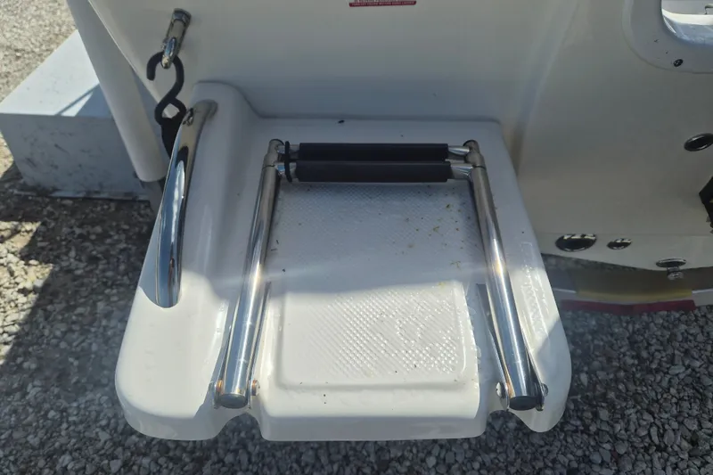 Slide: The Image of 2017 Key West 176 Bay Reef boat ladder on a gravel surface. - 5