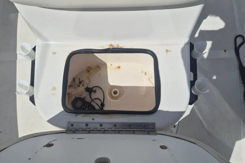 Slide: The Image of Open storage compartment on 2017 Key West 176 Bay Reef boat, showing interior details. - 18