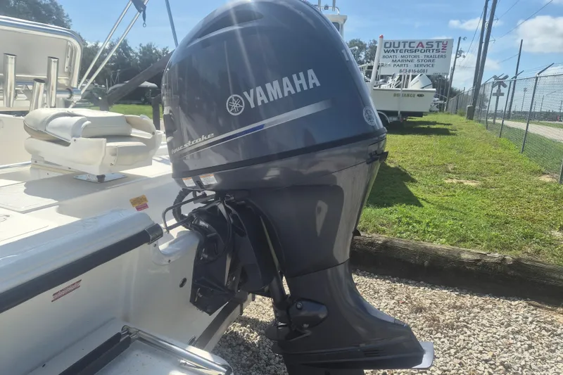 Slide: The Image of 2017 Key West 176 Bay Reef boat with Yamaha outboard motor in a sunny outdoor setting. - 4