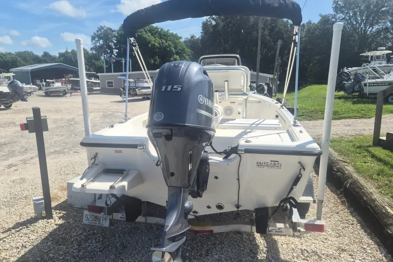 Slide: The Image of 2017 Key West 176 Bay Reef boat with Yamaha 115 engine in a sunny outdoor setting. - 3