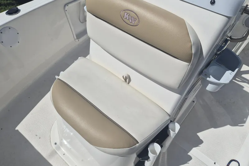 Slide: The Image of 2017 Key West 176 Bay Reef boat seat with beige and white upholstery. - 17