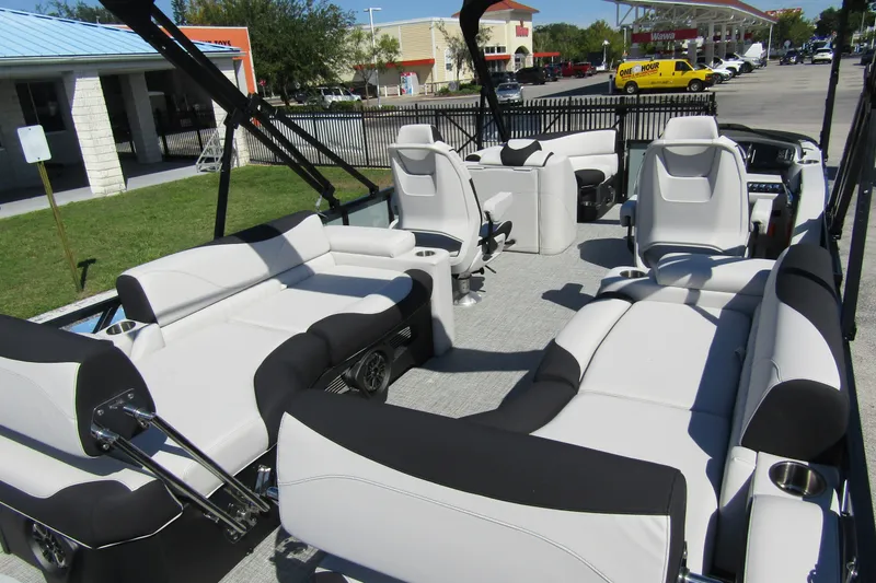 Slide: The Image of 2026 Tahoe Pontoon LTZ Quad Lounger Shift 23 with luxurious seating and modern design. - 33