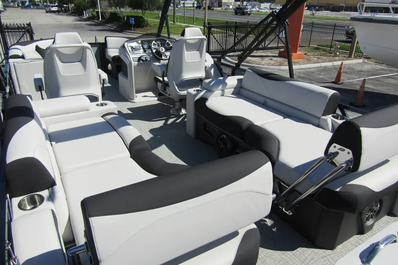 Slide: The Image of 2026 Tahoe Pontoon LTZ Quad Lounger Shift 23 interior with luxurious seating and modern design. - 32