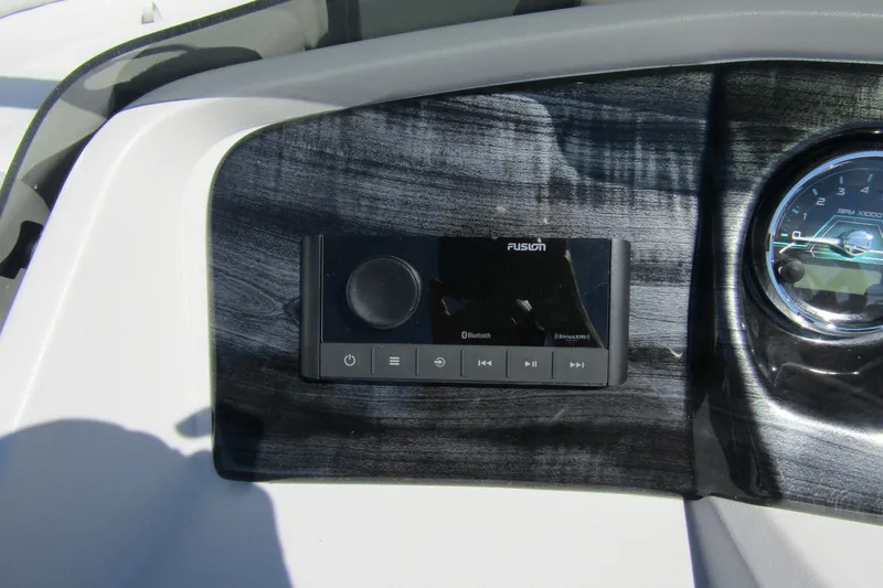 Slide: The Image of Dashboard of 2026 Tahoe Pontoon LTZ Quad Lounger Shift 23 with audio controls. - 18