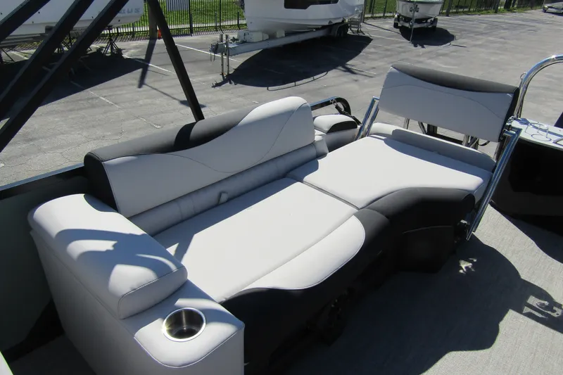 Slide: The Image of 2026 Tahoe Pontoon LTZ Quad Lounger Shift 23 with sleek seating and cup holder. - 25