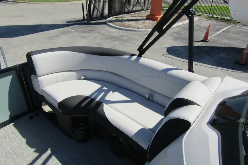 Slide: The Image of 2026 Tahoe Pontoon LTZ Quad Lounger Shift 23 with sleek white seating. - 13