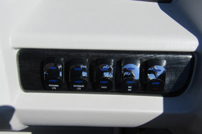 Slide: The Image of Control panel of 2026 Tahoe Pontoon LTZ Quad Lounger Shift 23 with labeled switches. - 22