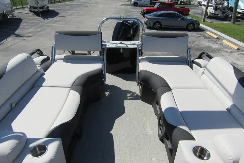 Slide: The Image of 2026 Tahoe Pontoon LTZ Quad Lounger Shift 23 interior with luxurious seating and cup holders. - 24