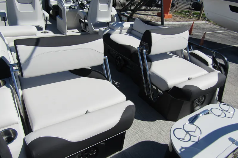 Slide: The Image of 2026 Tahoe Pontoon LTZ Quad Lounger Shift 23 interior with luxurious seating and modern design. - 29