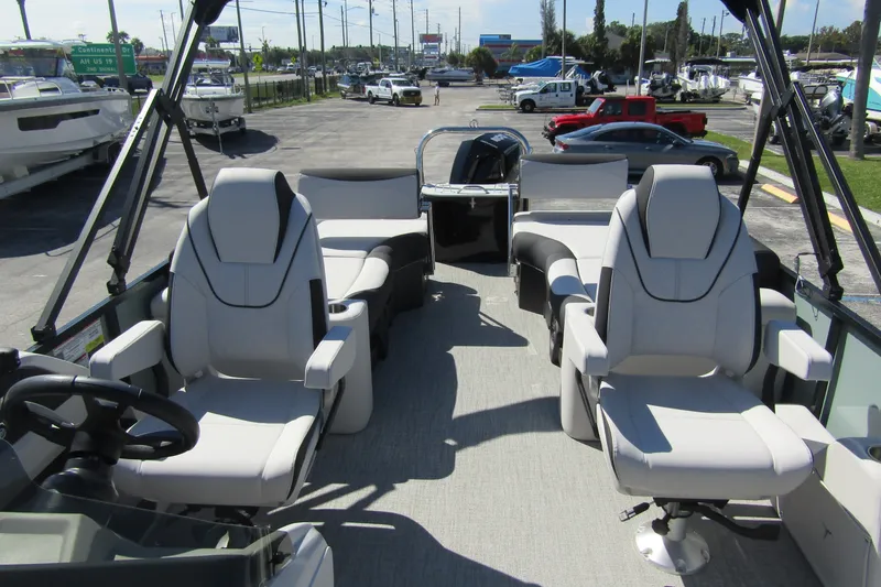 Slide: The Image of 2026 Tahoe Pontoon LTZ Quad Lounger Shift 23 interior with luxurious seating. - 15