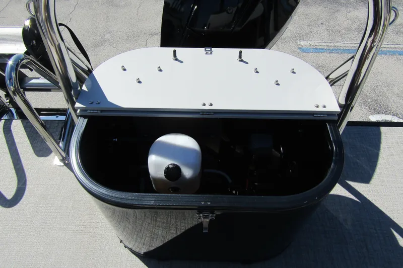 Slide: The Image of Open storage compartment on 2026 Tahoe Pontoon LTZ Quad Lounger Shift 23 boat. - 31