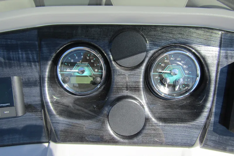 Slide: The Image of Dashboard of 2026 Tahoe Pontoon LTZ Quad Lounger Shift 23 with gauges. - 19