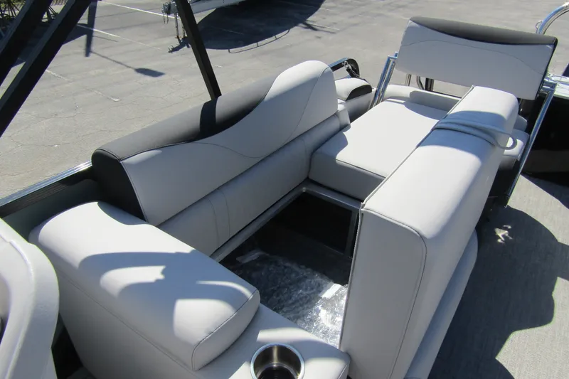 Slide: The Image of 2026 Tahoe Pontoon LTZ Quad Lounger Shift 23 interior with luxurious seating. - 26