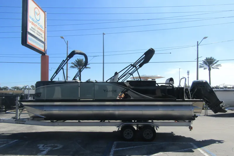 The Image of 2026 Tahoe Pontoon LTZ Quad Lounger Shift 23 on trailer at dealership. - 0