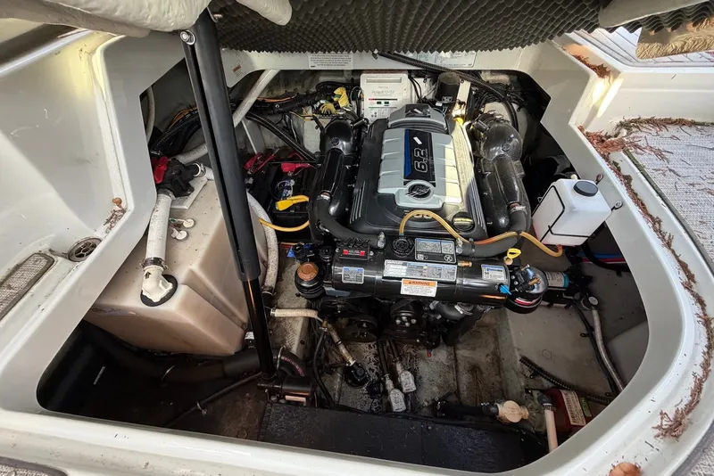 Slide: The Image of Engine compartment of a 2020 Crownline 264 CR boat, showcasing a 6.2L engine. - 11