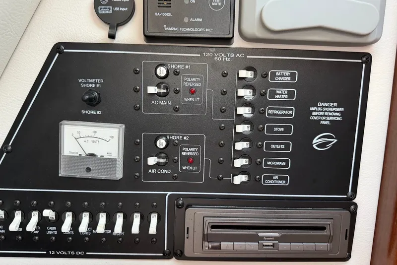 Slide: The Image of Control panel of a 2020 Crownline 264 CR boat with voltmeter and switches. - 22