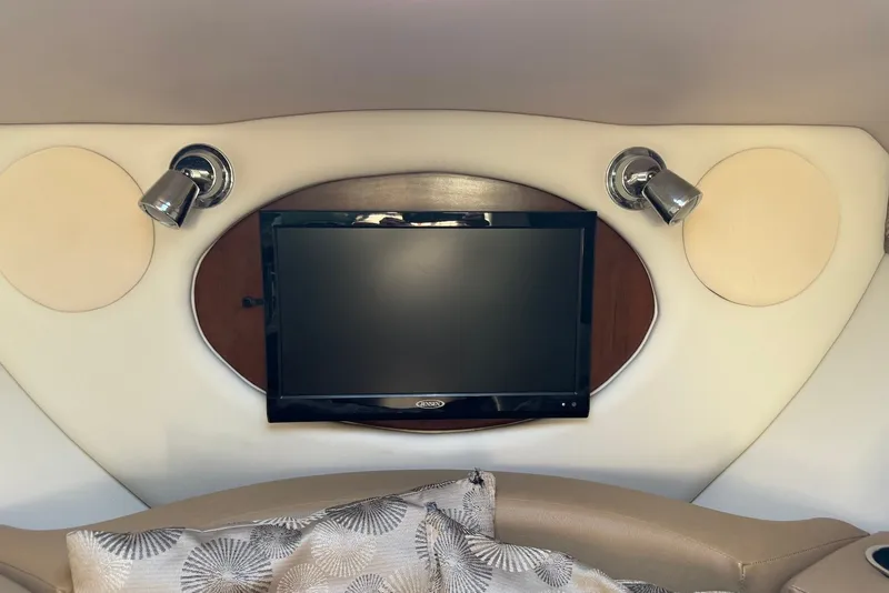Slide: The Image of Interior of 2020 Crownline 264 CR boat with TV and reading lights. - 17