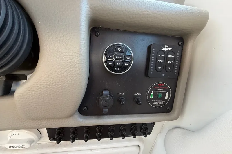 Slide: The Image of Control panel of a 2020 Crownline 264 CR boat with various switches and buttons. - 9