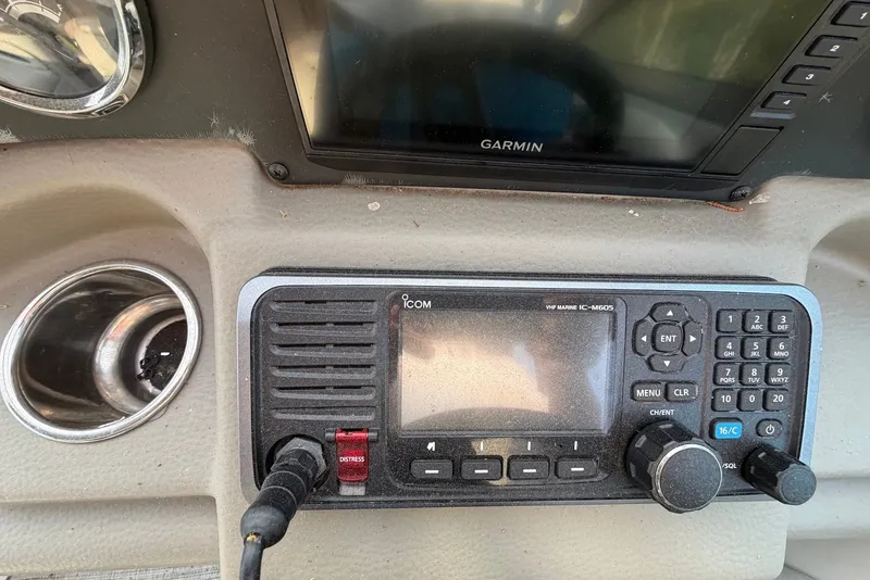 Slide: The Image of Control panel of a 2020 Crownline 264 CR boat with Garmin and Icom marine radio. - 8