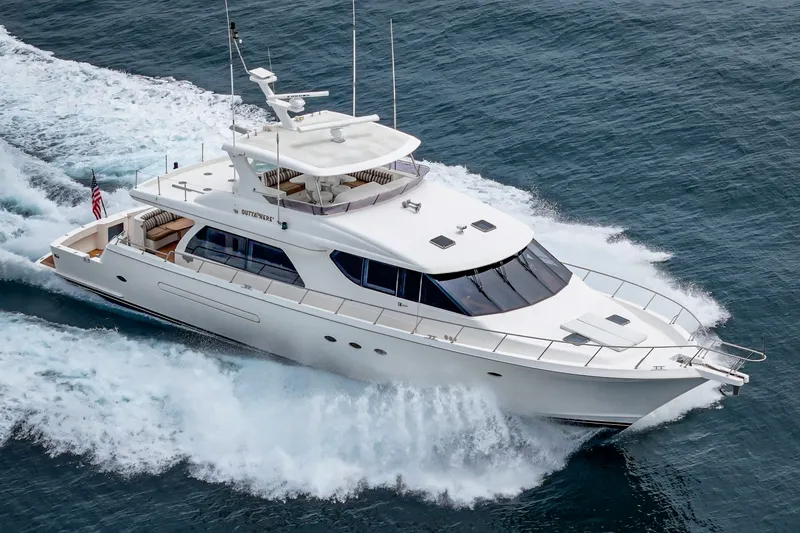 Slide: The Image of A luxurious white yacht speeds through the sea, featuring a spacious deck and modern superstructure. - 3