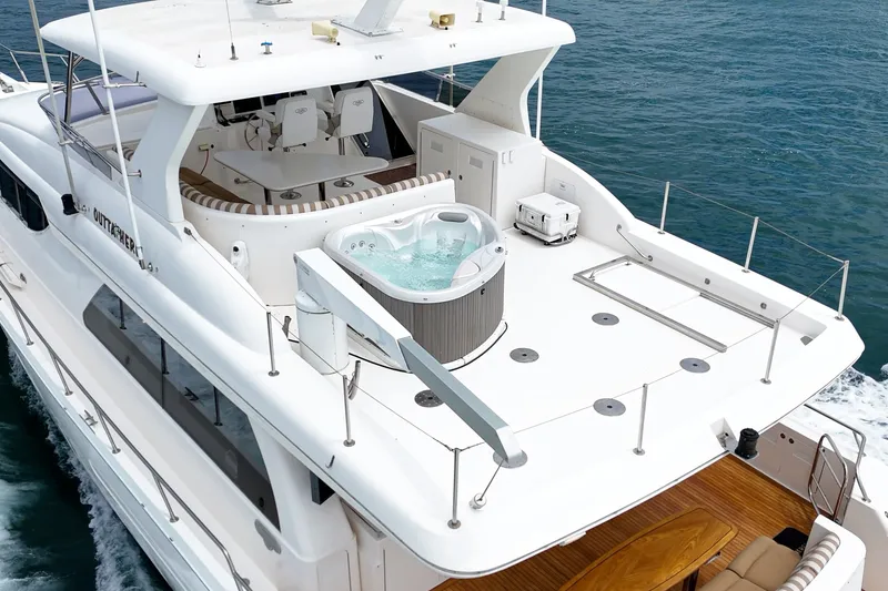 Slide: The Image of A luxurious yacht with a hot tub on the upper deck, surrounded by blue water. - 14