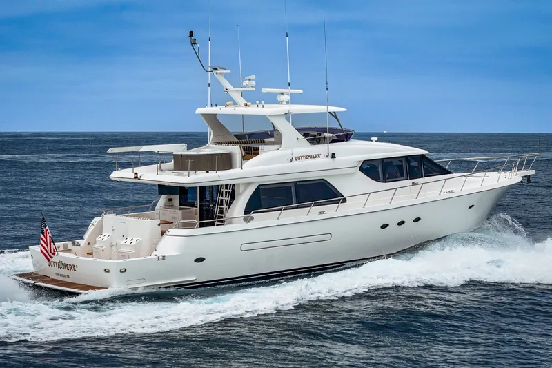Slide: The Image of A luxurious white yacht cruising on the sea, featuring multiple decks and an American flag. - 4