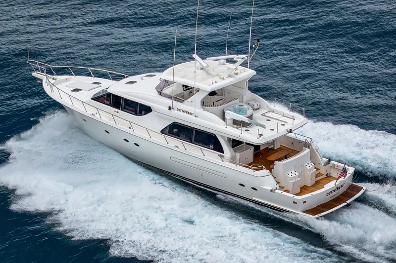 Slide: The Image of A luxurious white yacht speeding across the sea, featuring a spacious deck and multiple antennas. - 5