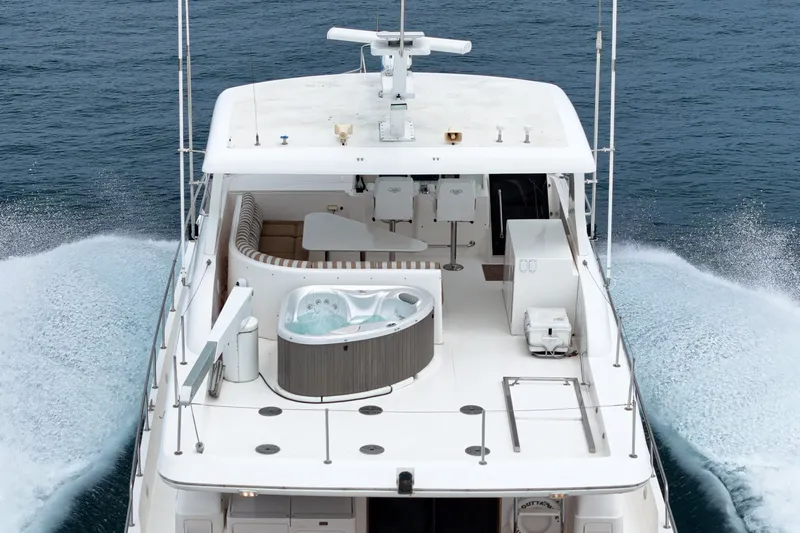 Slide: The Image of A luxurious yacht with a hot tub on deck, cruising through calm waters. - 13
