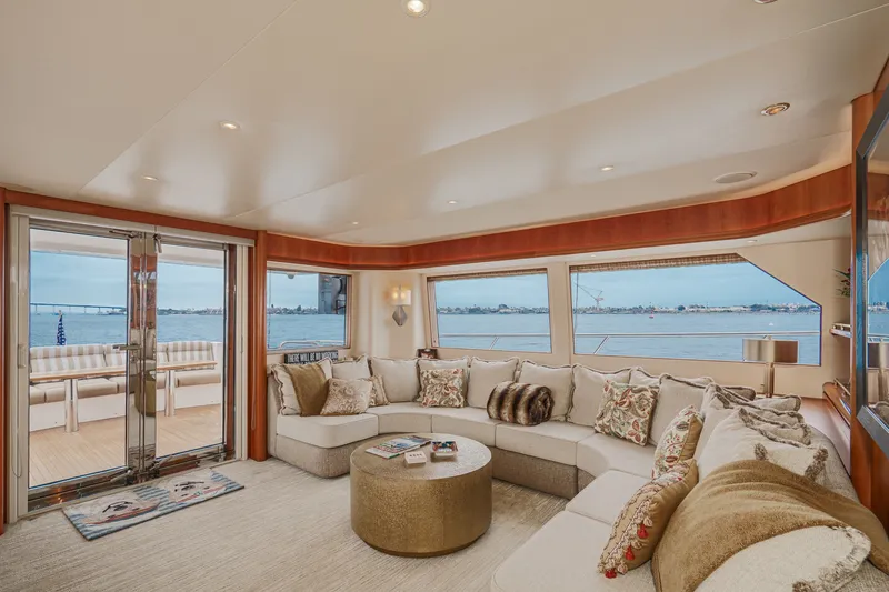 Slide: The Image of Luxurious salon with large windows, comfortable sofas, and terrace access on a West Bay 80 CPMY yacht. - 42