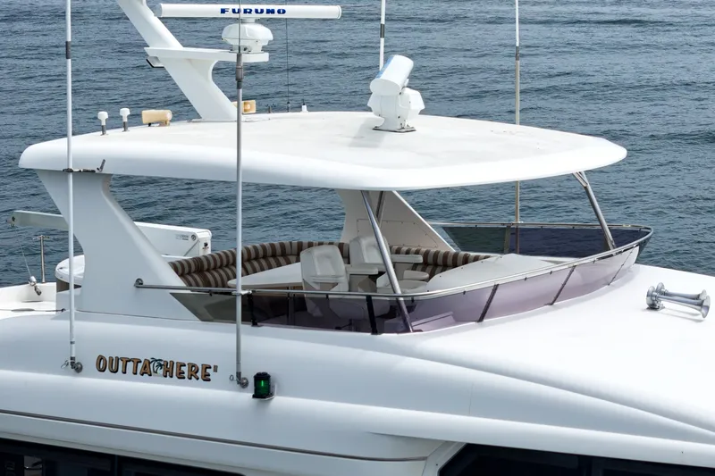 Slide: The Image of A luxury yacht with a covered seating area and radar equipment on the roof. - 11