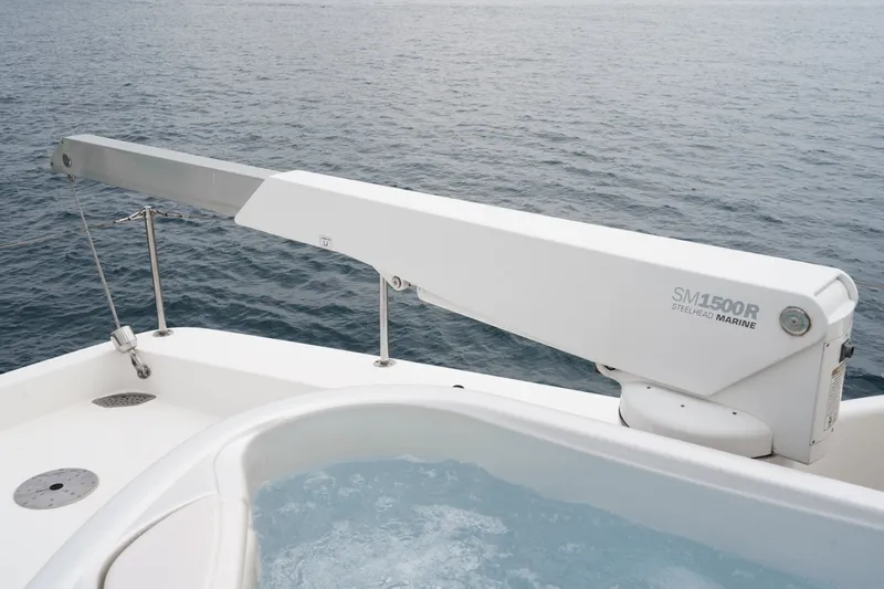 Slide: The Image of A 2005 West Bay 80 CPMY featuring a hot tub and crane on the deck. - 18