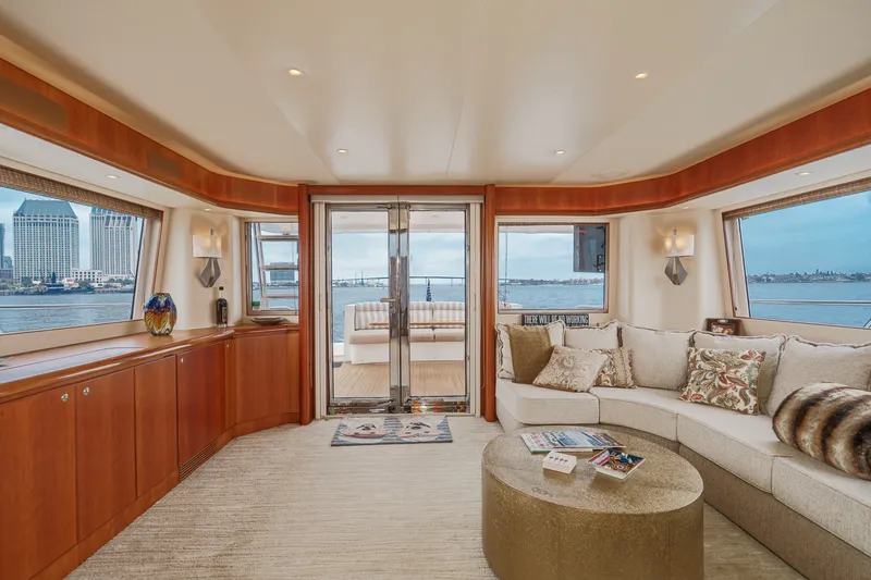 Slide: The Image of Luxurious salon with large windows, comfortable sofas, and a round coffee table, offering stunning views. - 41