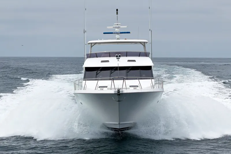 Slide: The Image of A 2005 West Bay 80 CPMY yacht speeds across the sea, creating a splash of water. - 9