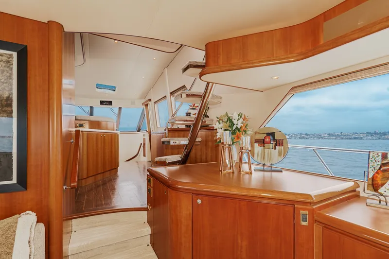 Slide: The Image of Luxurious interior of a 2005 West Bay 80 CPMY with wood paneling and large windows. - 47